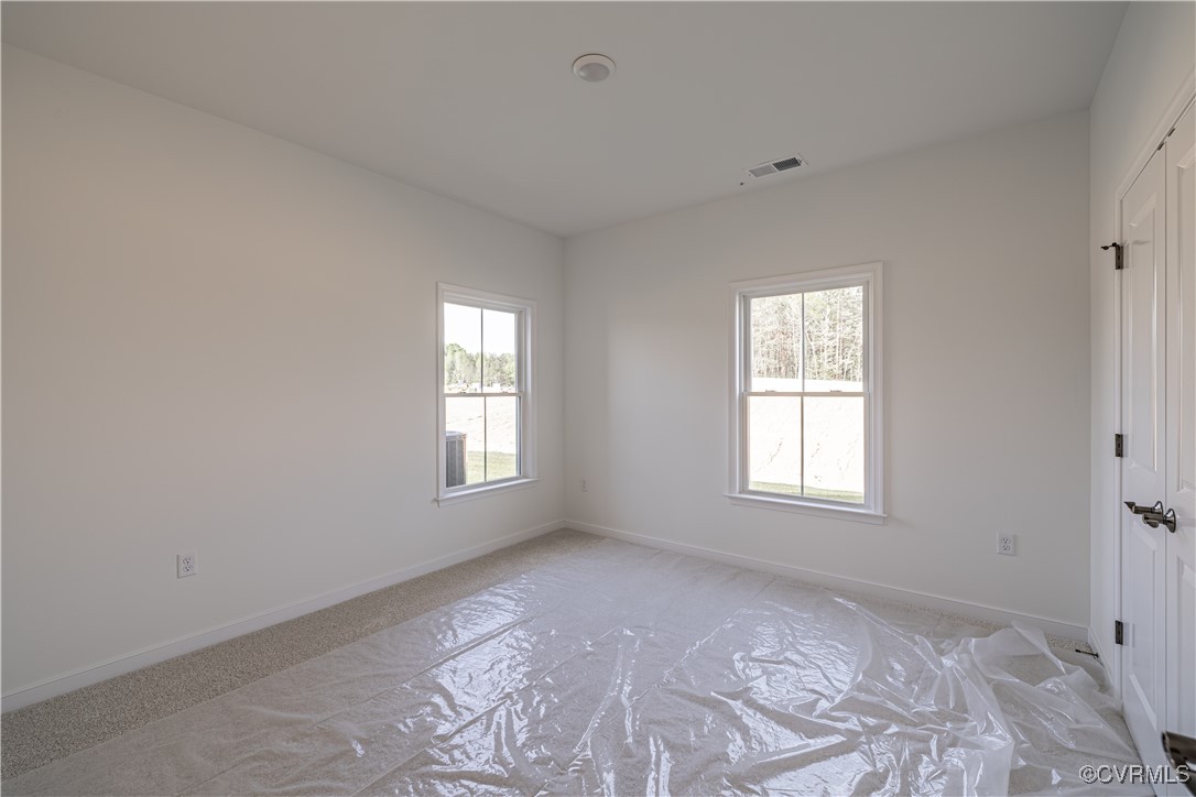 6649 Mayland Ridge Lane Moseley, VA 23120 - Photo 21 of 32 a view of an empty room with a window