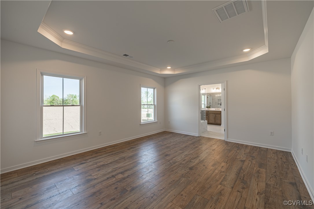 6649 Mayland Ridge Lane Moseley, VA 23120 - Photo 22 of 32 an empty room with wooden floor and windows