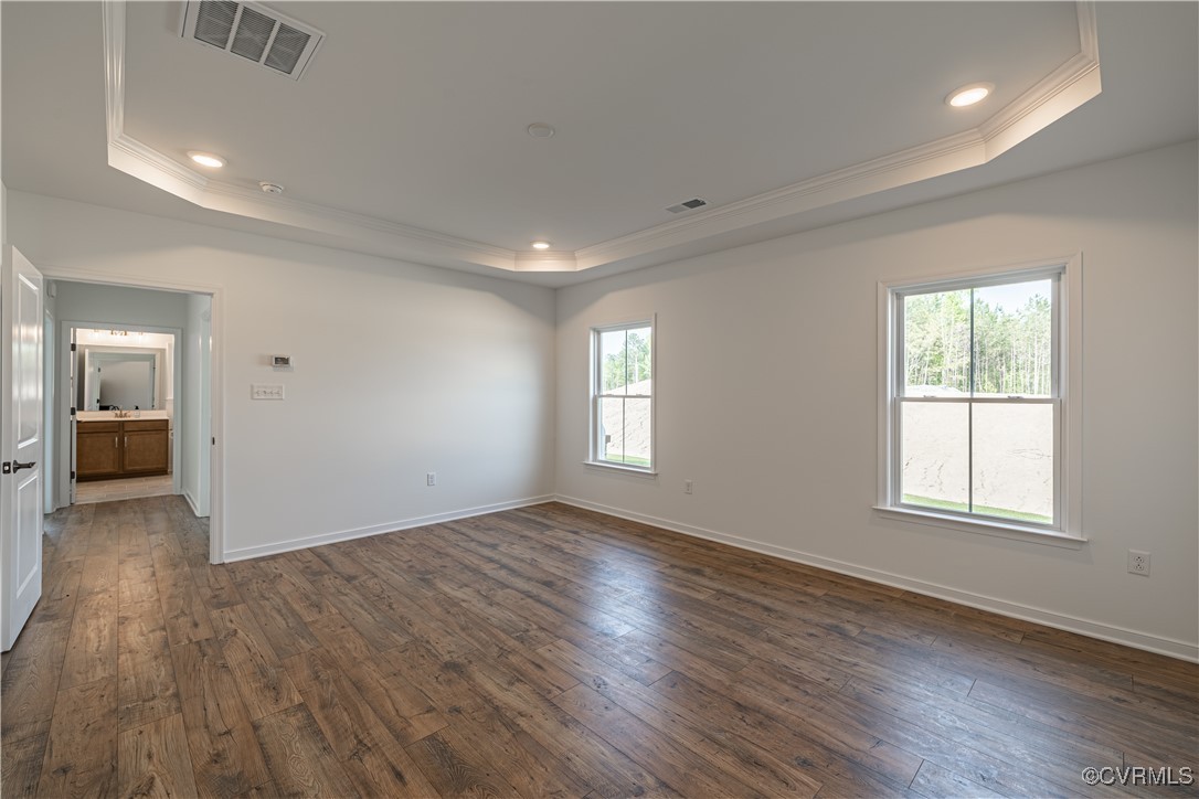 6649 Mayland Ridge Lane Moseley, VA 23120 - Photo 23 of 32 an empty room with wooden floor and windows
