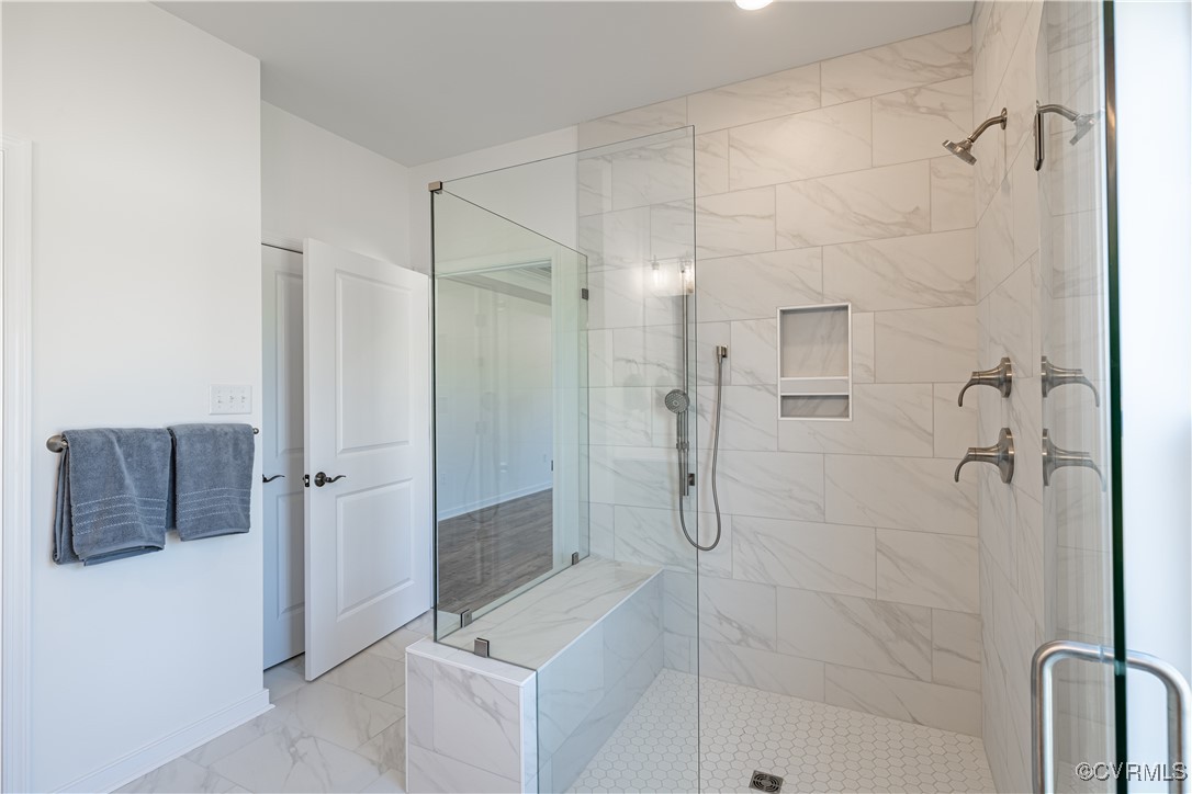 6649 Mayland Ridge Lane Moseley, VA 23120 - Photo 27 of 32 a bathroom with a shower and a sink
