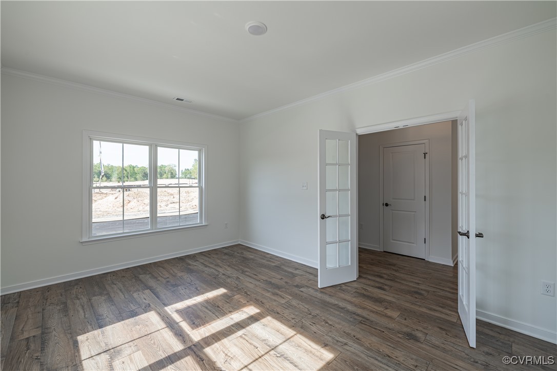 6649 Mayland Ridge Lane Moseley, VA 23120 - Photo 4 of 32 a view of an empty room with wooden floor and a window
