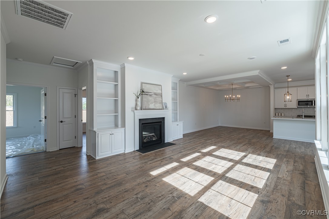 6649 Mayland Ridge Lane Moseley, VA 23120 - Photo 5 of 32 a view of empty room with wooden floor and fireplace