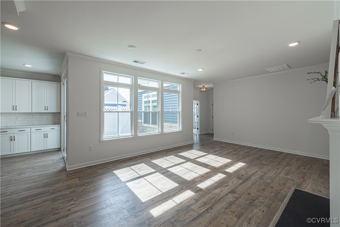 6649 Mayland Ridge Lane Moseley, VA 23120 - Photo 7 of 32 a view of empty room with wooden floor and fan