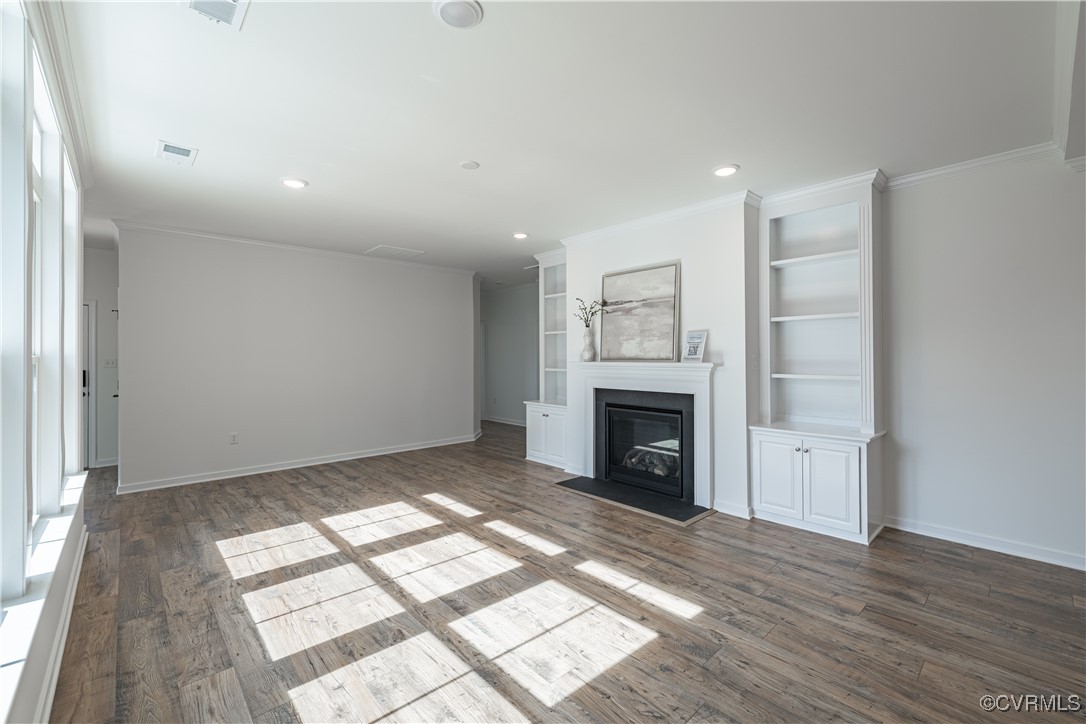 6649 Mayland Ridge Lane Moseley, VA 23120 - Photo 8 of 32 a view of empty room with wooden floor and fireplace