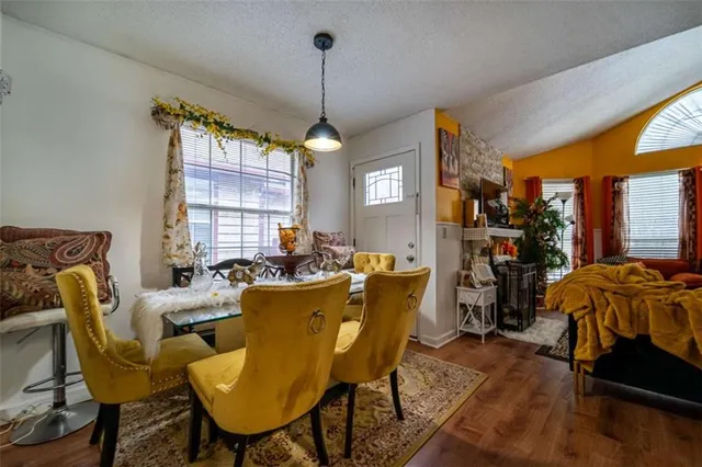 a living room with furniture a window and a chandelier