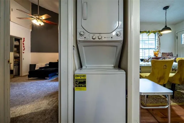 a view of living room with furniture and a chandelier