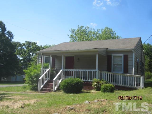 595 Providence Road Roxboro, NC 27573 - Photo 1 of 14 a view of a house with backyard and a tree