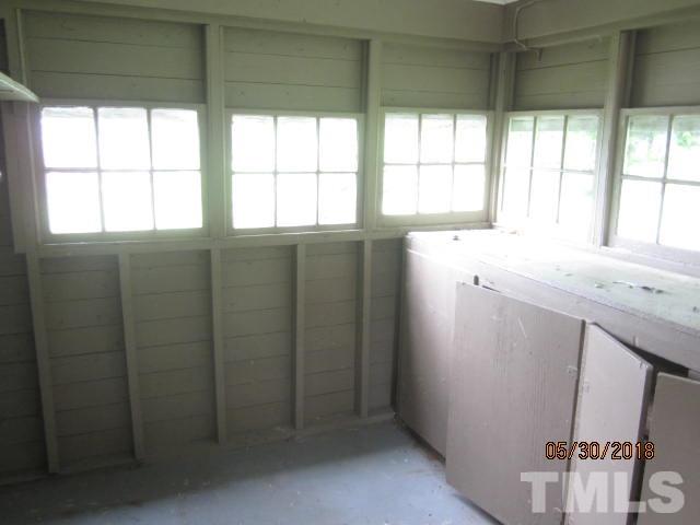 595 Providence Road Roxboro, NC 27573 - Photo 14 of 14 a bathroom with a granite countertop sink and a window