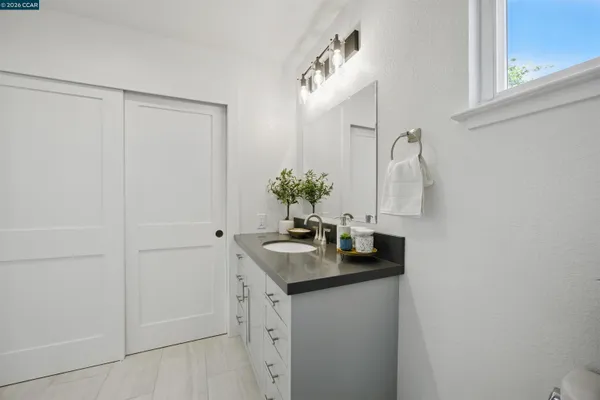 a bathroom with a bathtub shower and toilet