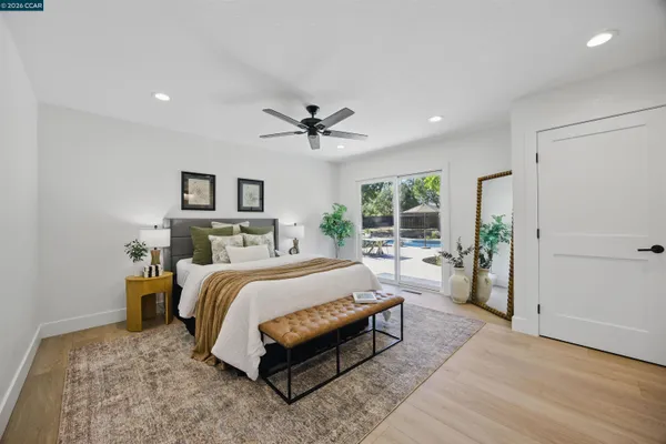 a bed room with a bed and a potted plant