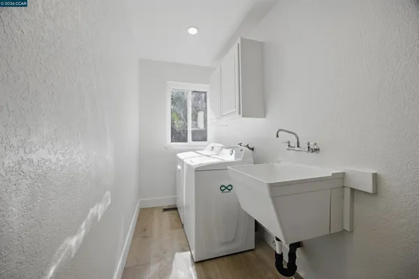 a view of a swimming pool with a patio and fire pit