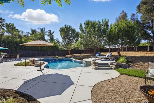 a view of swimming pool with outdoor seating