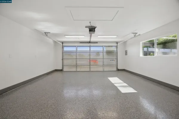 front view of a house with a flower garden