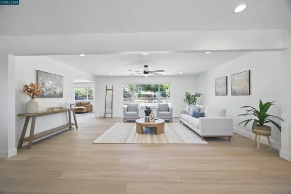 a living room with furniture or window and a wooden floor