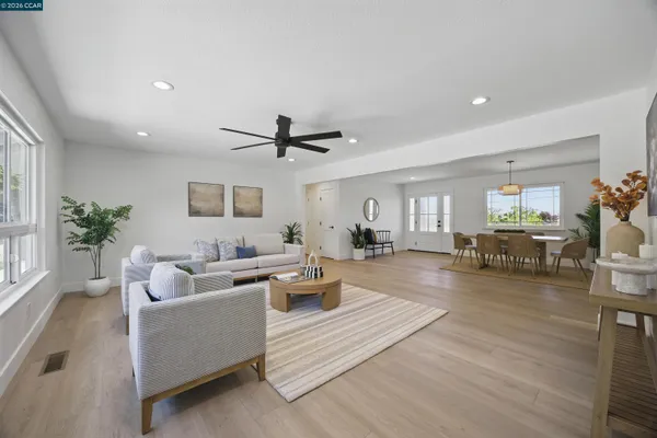 a view of a living room and dining room