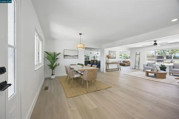 a view of a livingroom with furniture and wooden floor