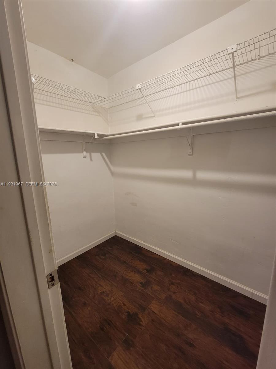 4321 Northwest 9th Avenue, Unit 102 Deerfield Beach, FL 33064 - Photo 19 of 34 a view of an empty walk in closet
