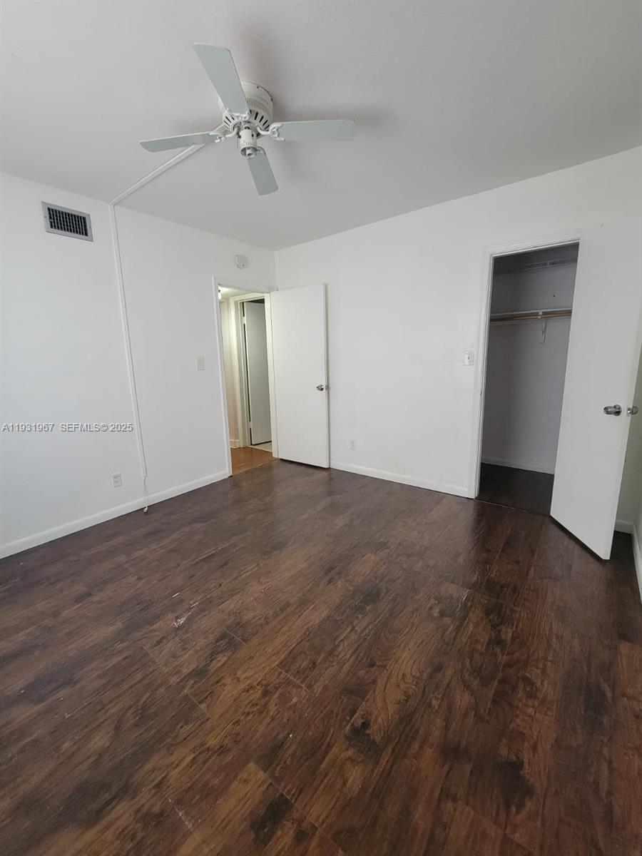 4321 Northwest 9th Avenue, Unit 102 Deerfield Beach, FL 33064 - Photo 20 of 34 wooden floor in an empty room