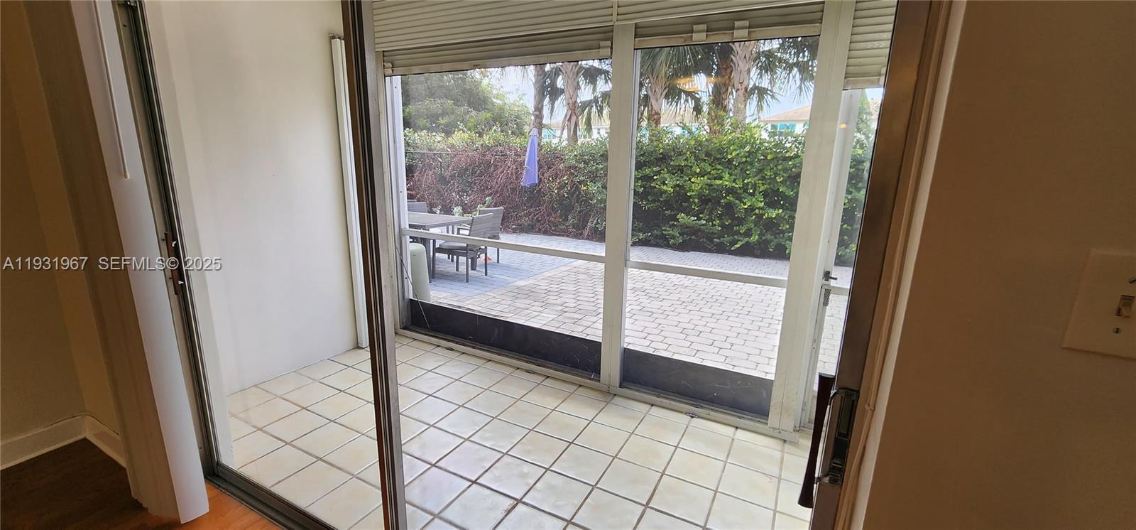 4321 Northwest 9th Avenue, Unit 102 Deerfield Beach, FL 33064 - Photo 29 of 34 Back door to patio