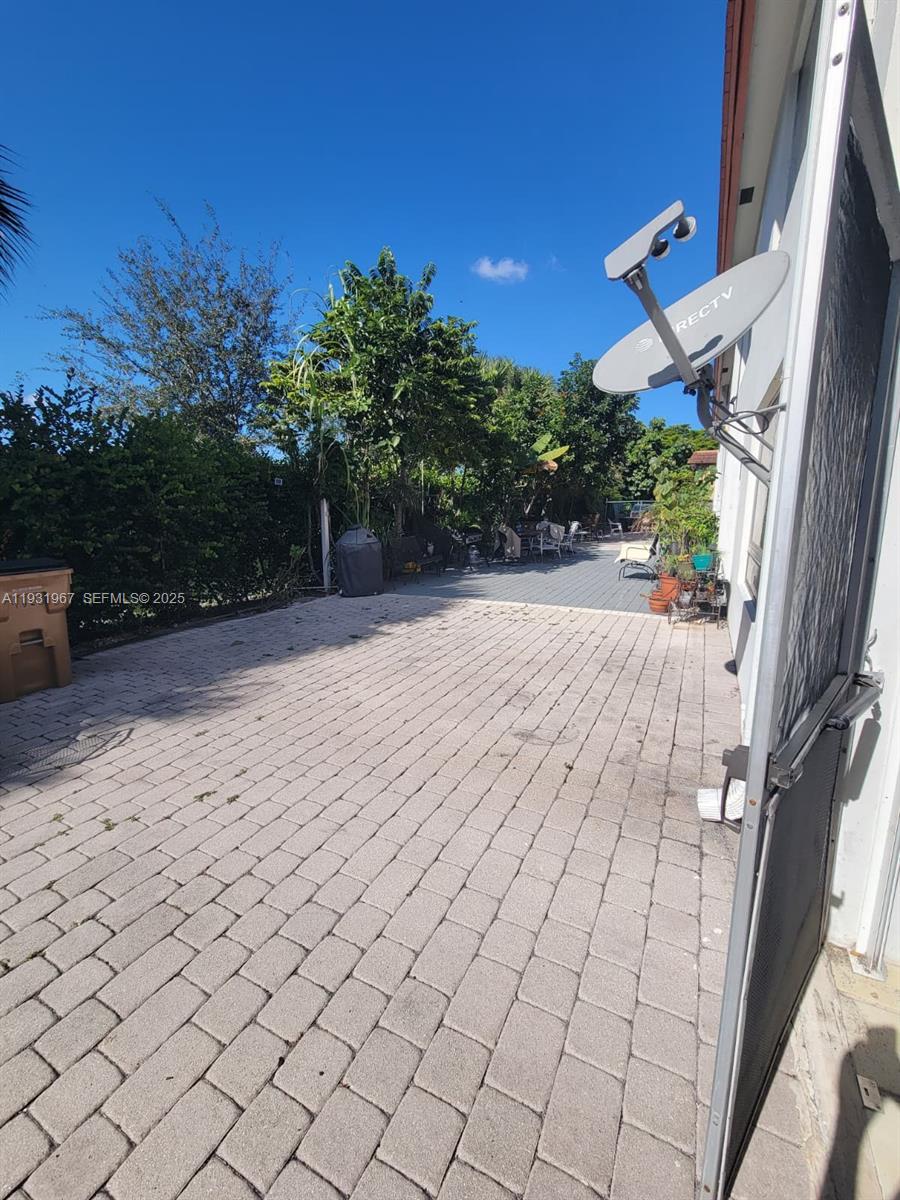 4321 Northwest 9th Avenue, Unit 102 Deerfield Beach, FL 33064 - Photo 30 of 34 a view of outdoor space and yard