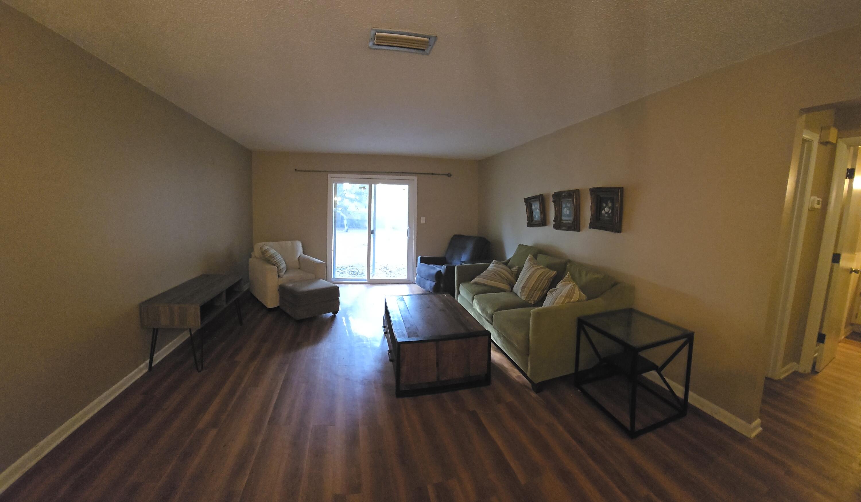 17 7th Street, Unit 2 Shalimar, FL 32579 - Photo 12 of 29 a living room with furniture and a wooden floor