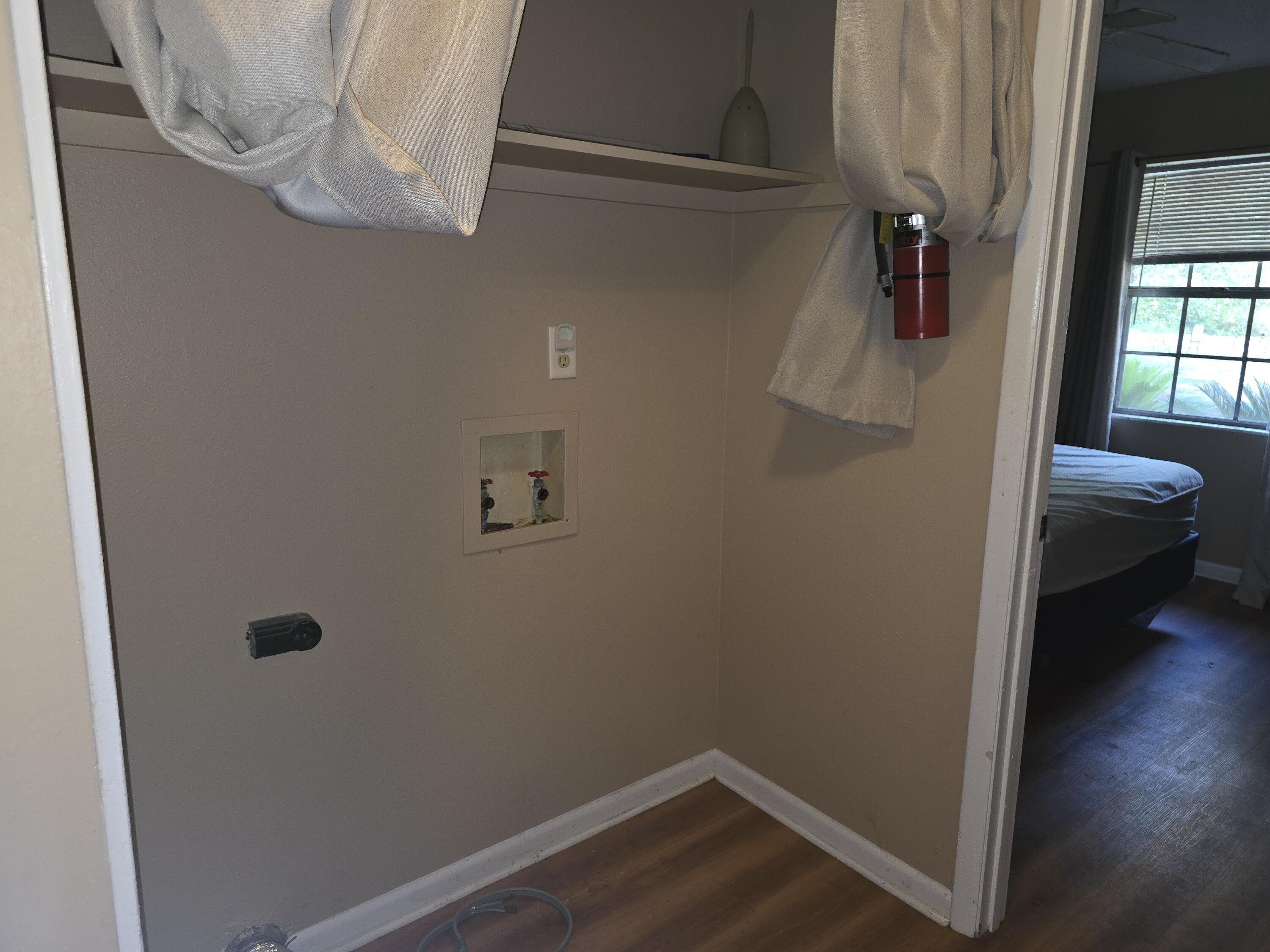17 7th Street, Unit 2 Shalimar, FL 32579 - Photo 15 of 29 a view of a hallway with wooden floor and closet
