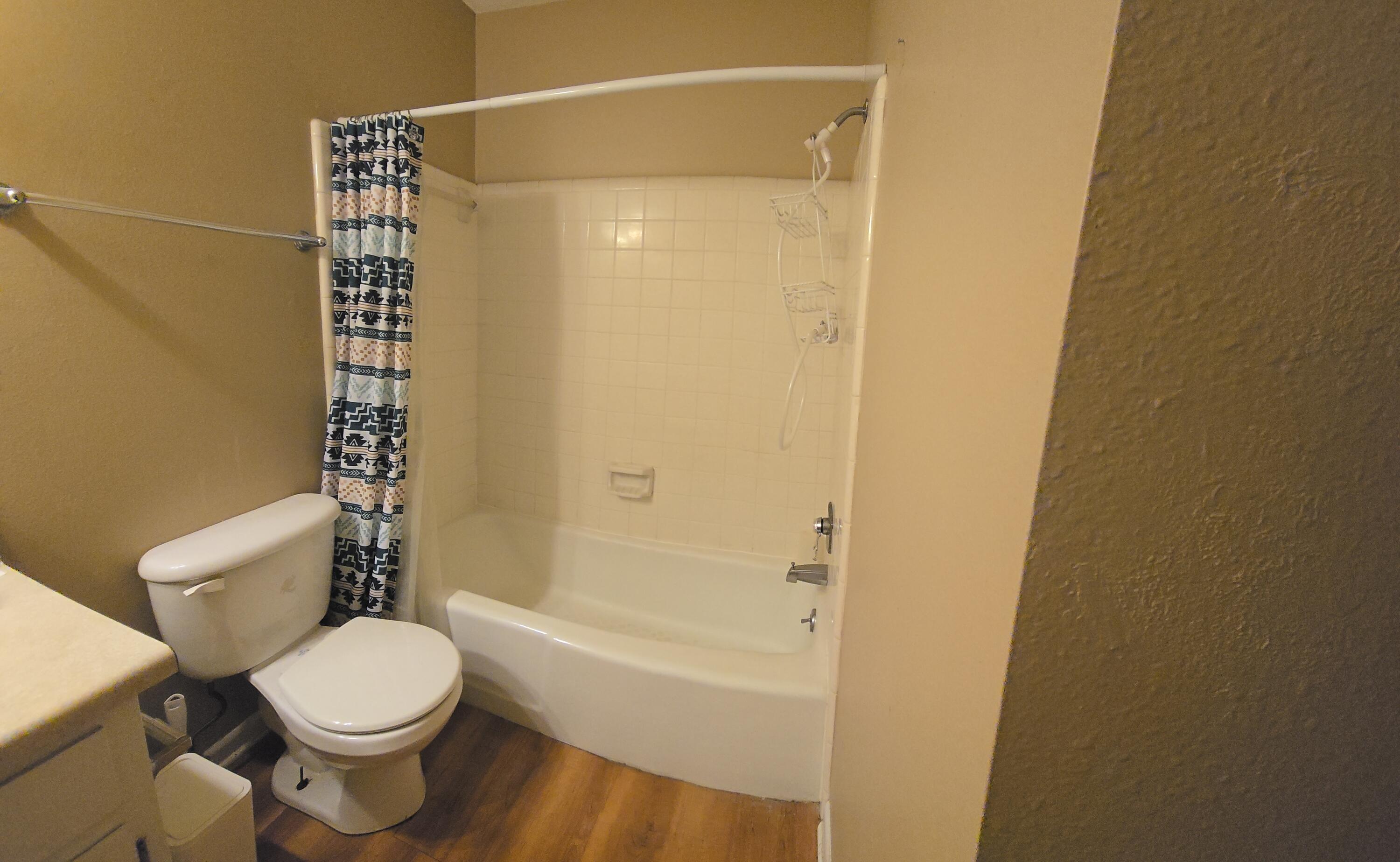 17 7th Street, Unit 2 Shalimar, FL 32579 - Photo 16 of 29 a bathroom with a toilet and a shower