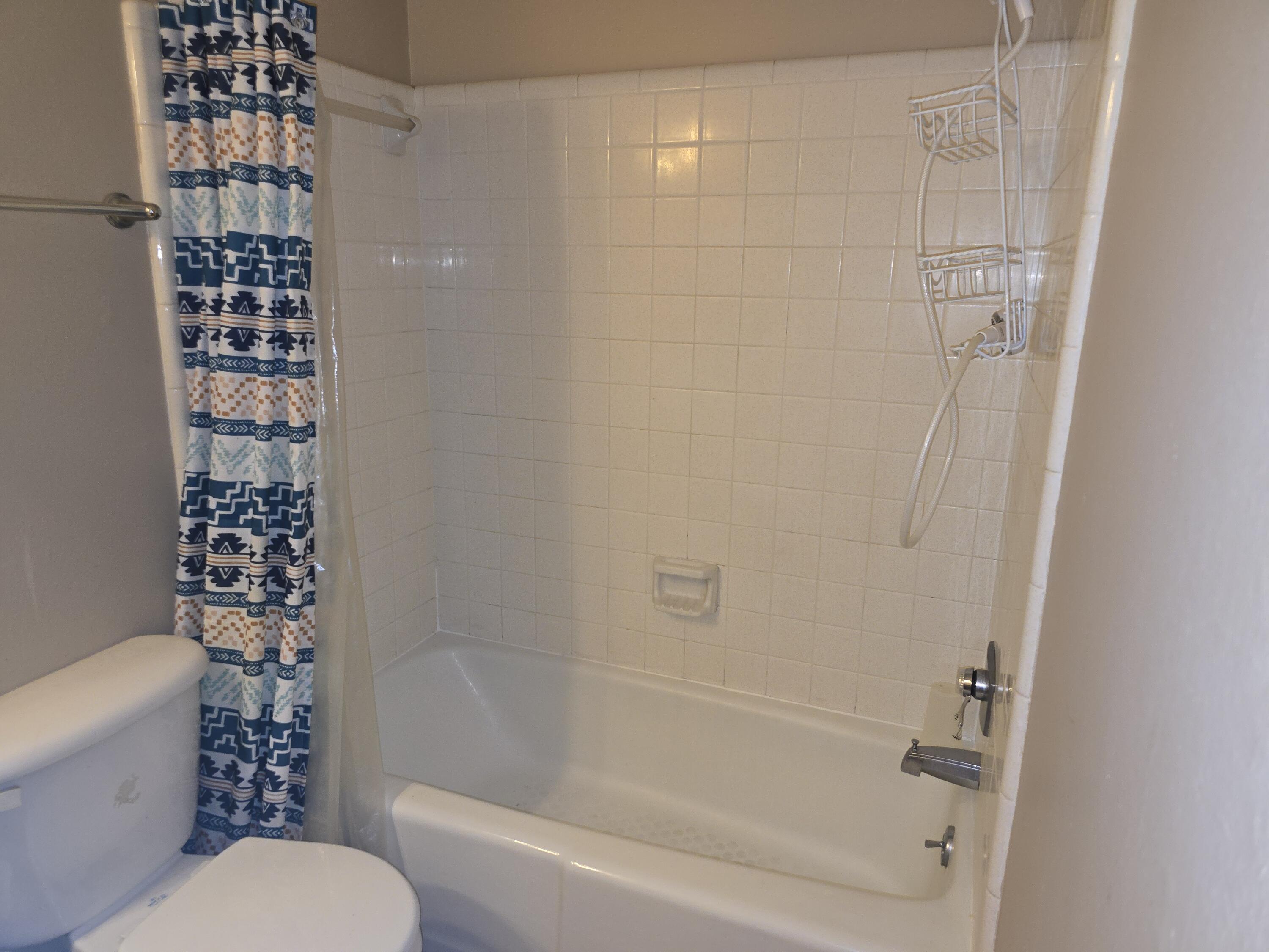 17 7th Street, Unit 2 Shalimar, FL 32579 - Photo 17 of 29 a bathroom with a toilet and a bathtub