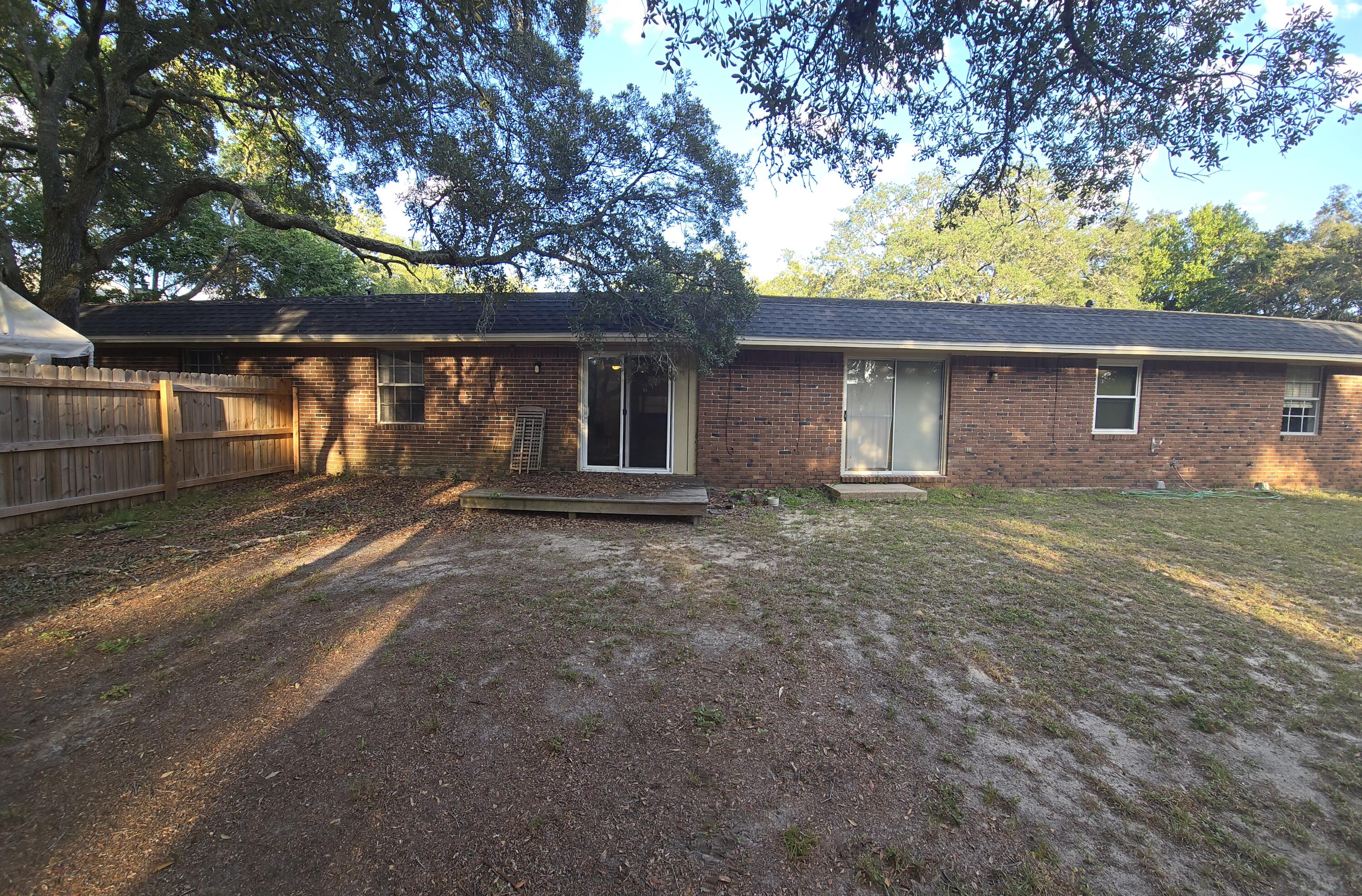 17 7th Street, Unit 2 Shalimar, FL 32579 - Photo 26 of 29 a backyard of a house with barbeque oven