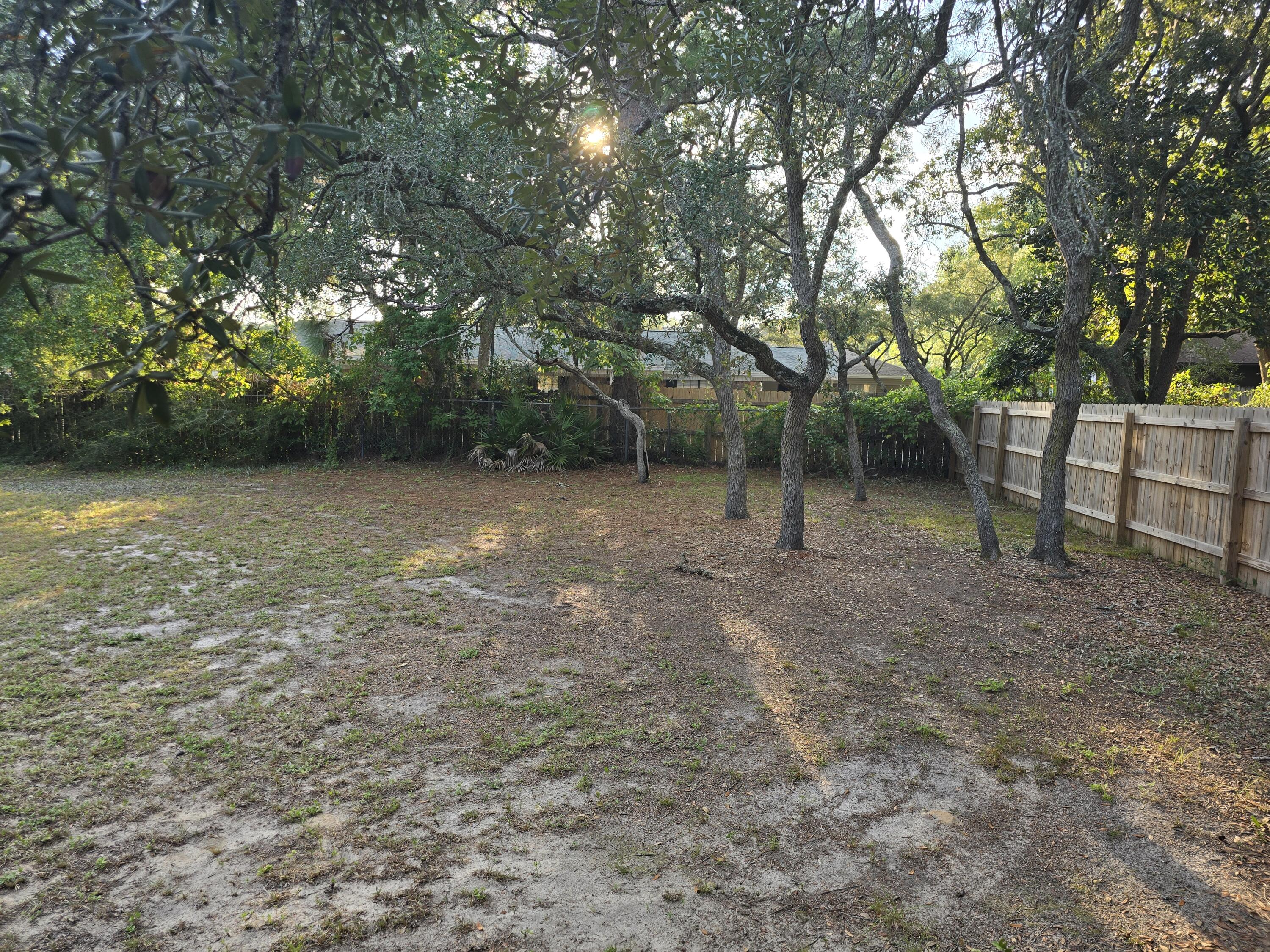 17 7th Street, Unit 2 Shalimar, FL 32579 - Photo 28 of 29 a view of a backyard with trees