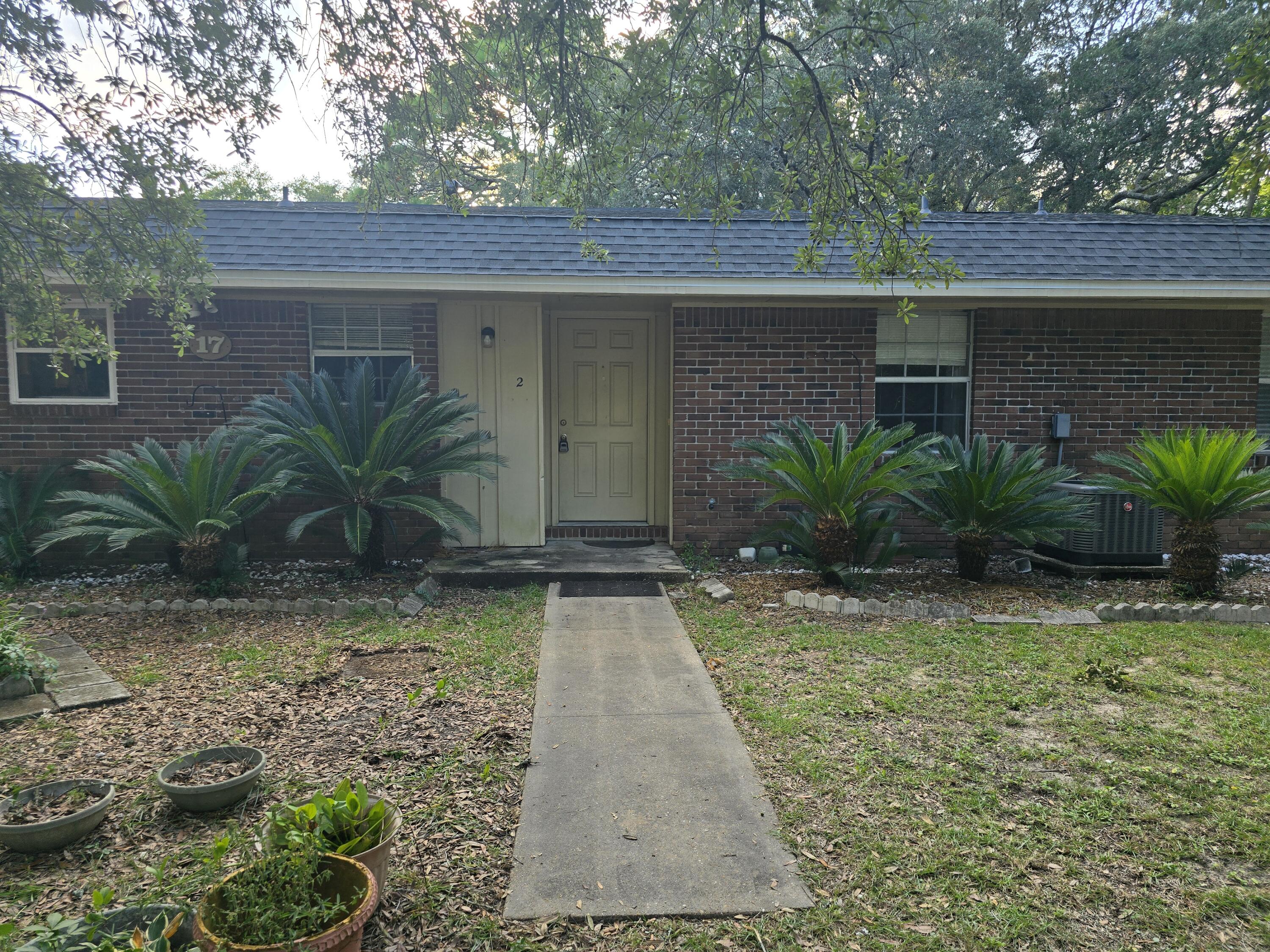 17 7th Street, Unit 2 Shalimar, FL 32579 - Photo 29 of 29 a view of a backyard with plants