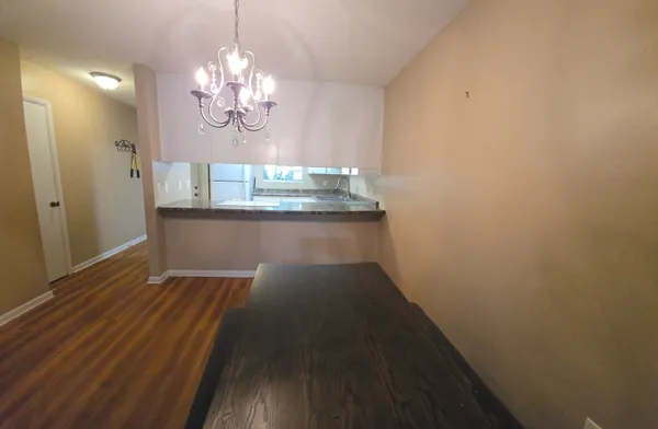 a view of a livingroom from a hallway