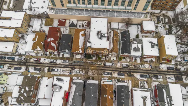 a city view of a building with cars