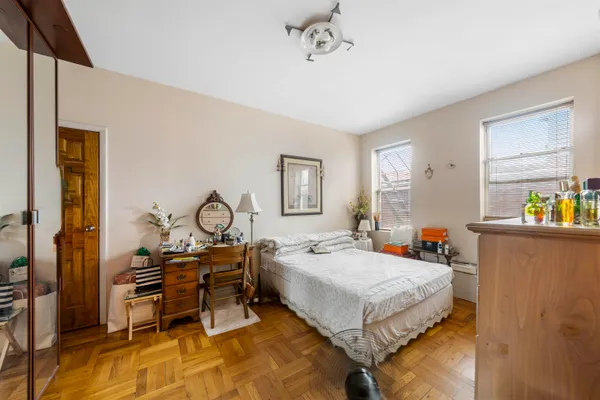 a bedroom with a bed and a table in it