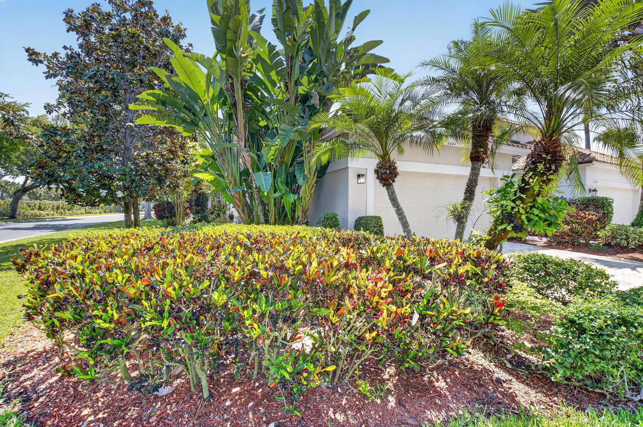 6694 Northwest 26th Way Boca Raton, FL 33496 - Photo 2 of 58 a view of outdoor space with garden