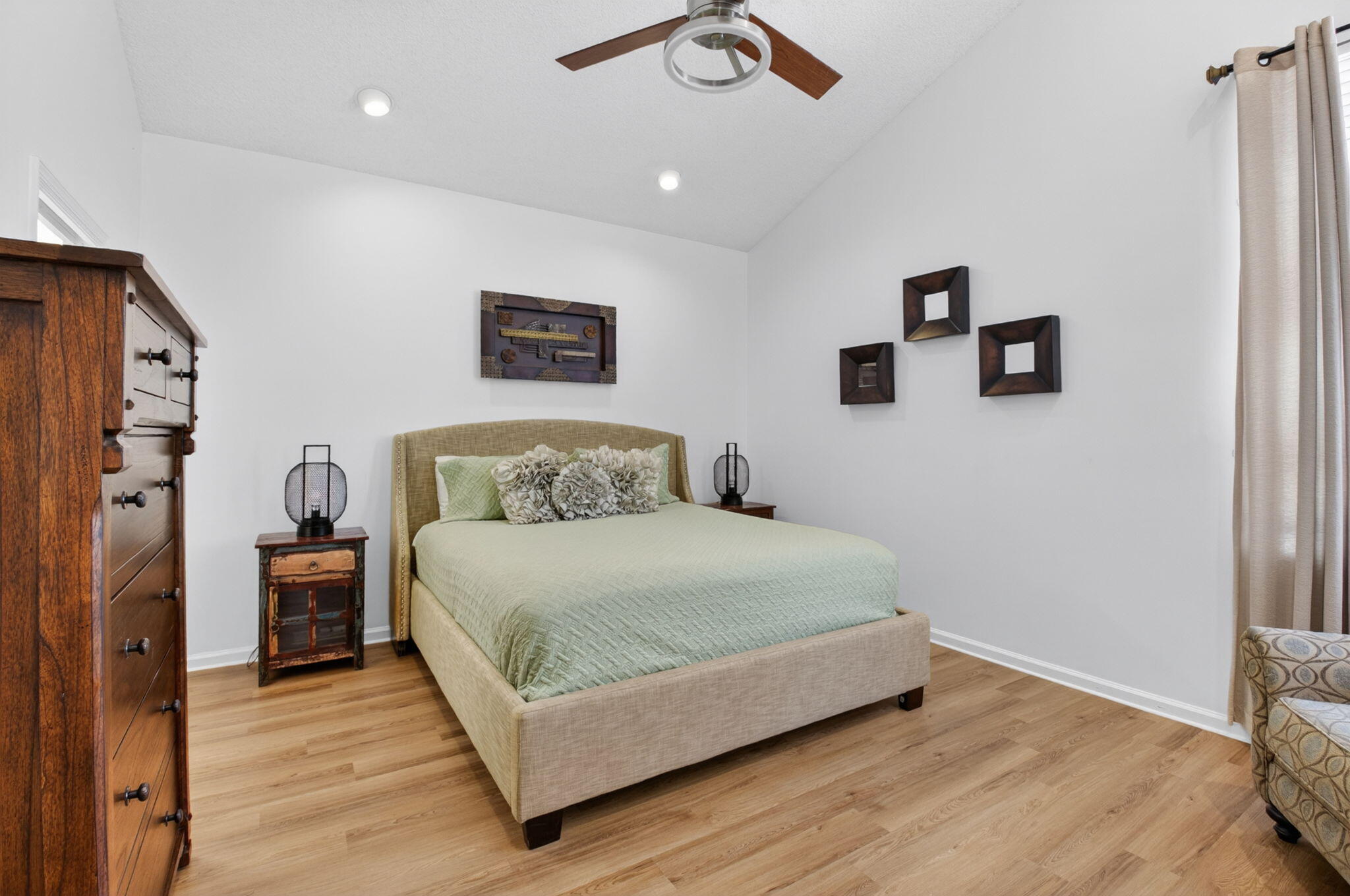 6694 Northwest 26th Way Boca Raton, FL 33496 - Photo 23 of 58 a bedroom with a bed and a table