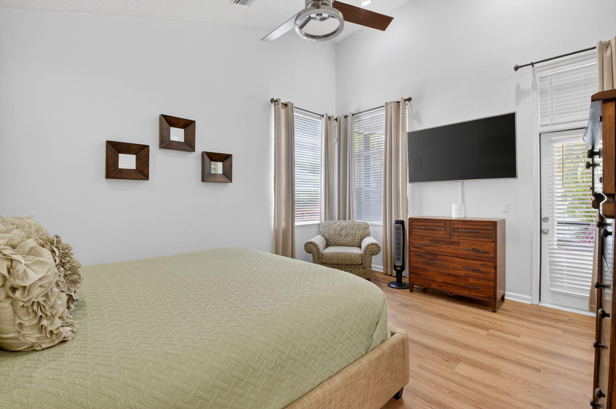 6694 Northwest 26th Way Boca Raton, FL 33496 - Photo 24 of 58 a bedroom with a bed a flat screen tv and dresser