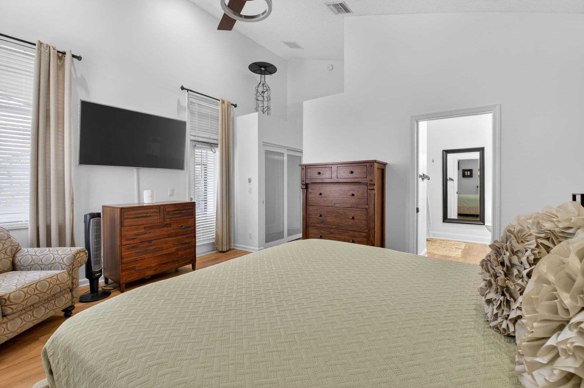 6694 Northwest 26th Way Boca Raton, FL 33496 - Photo 25 of 58 a bedroom with a bed and a television