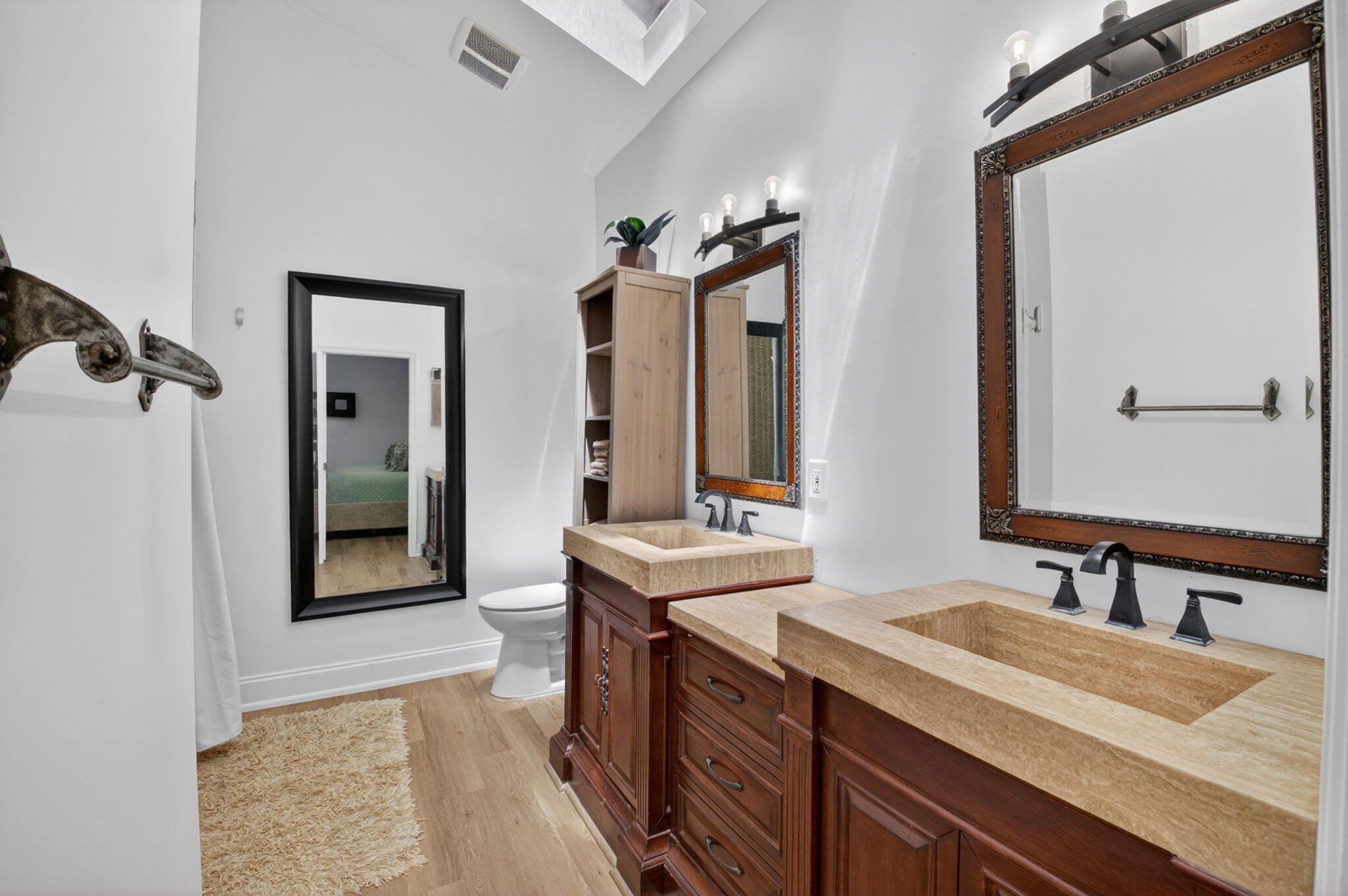 6694 Northwest 26th Way Boca Raton, FL 33496 - Photo 26 of 58 a spacious bathroom with a granite countertop sink and a mirror