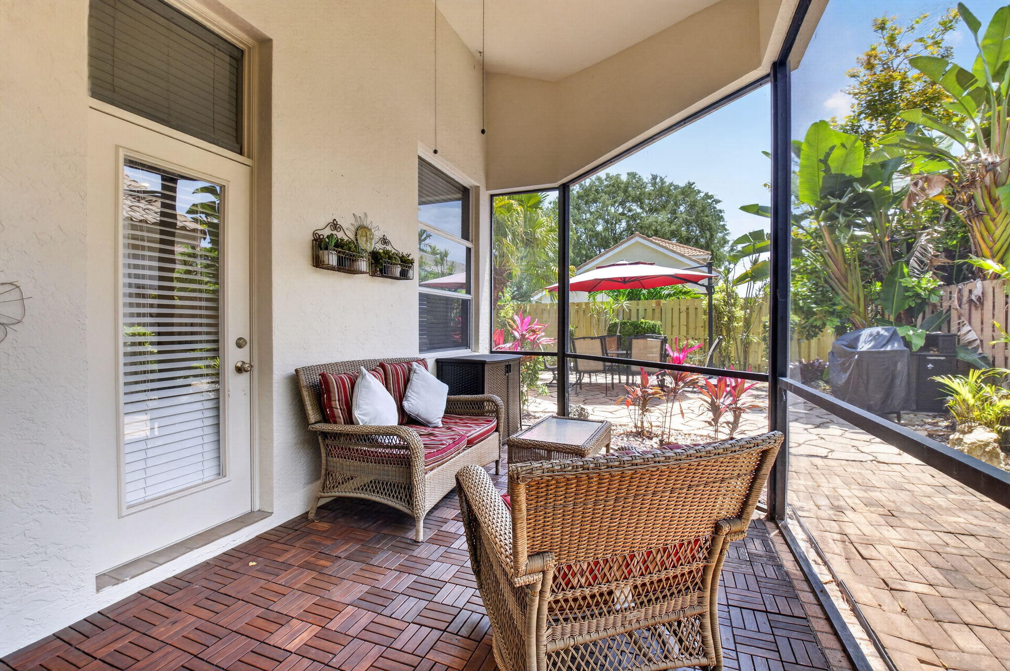 6694 Northwest 26th Way Boca Raton, FL 33496 - Photo 34 of 58 a outdoor space with the couches and dining table with the garden view