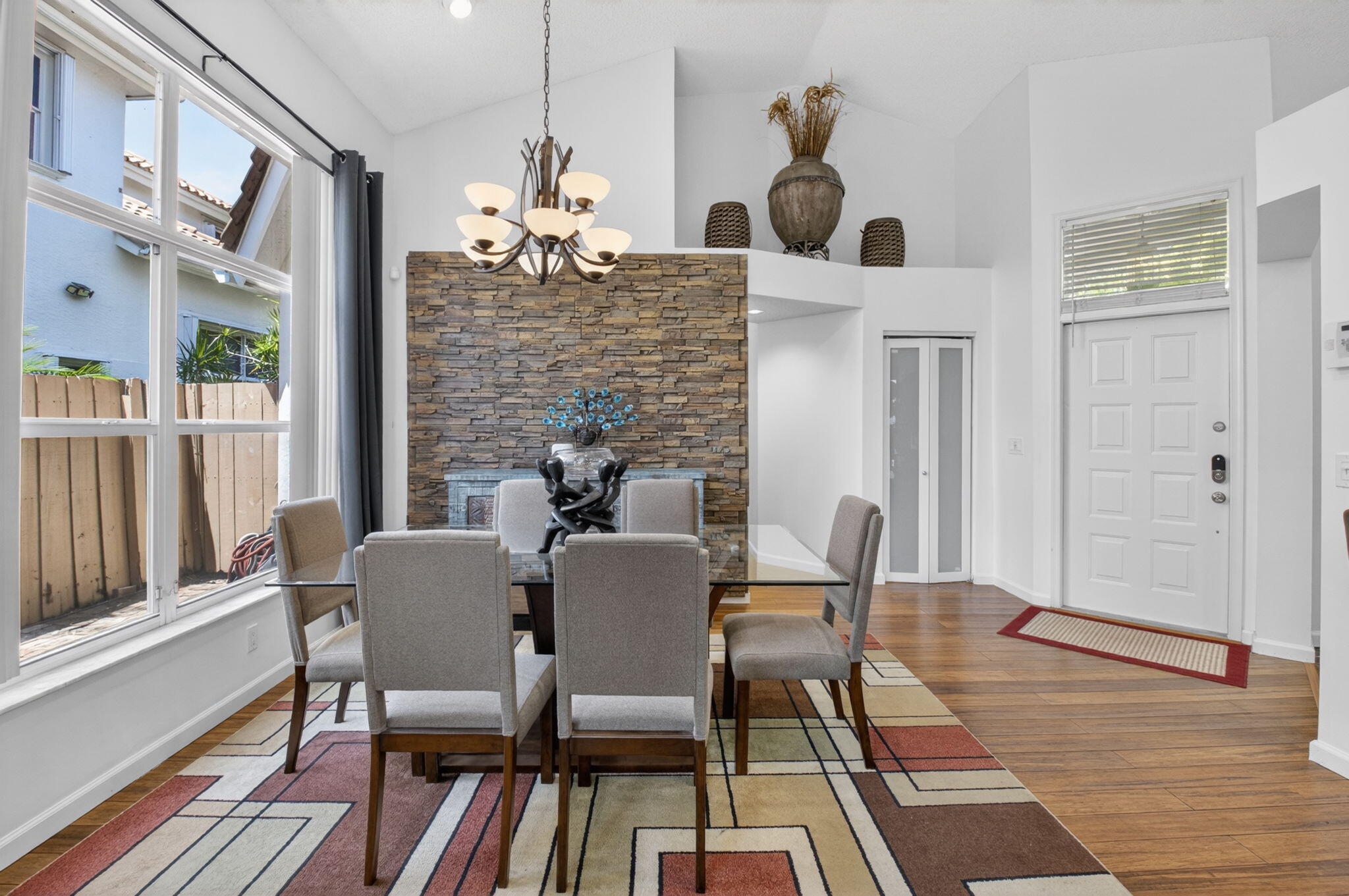 6694 Northwest 26th Way Boca Raton, FL 33496 - Photo 6 of 58 a dining room with furniture and wooden floor