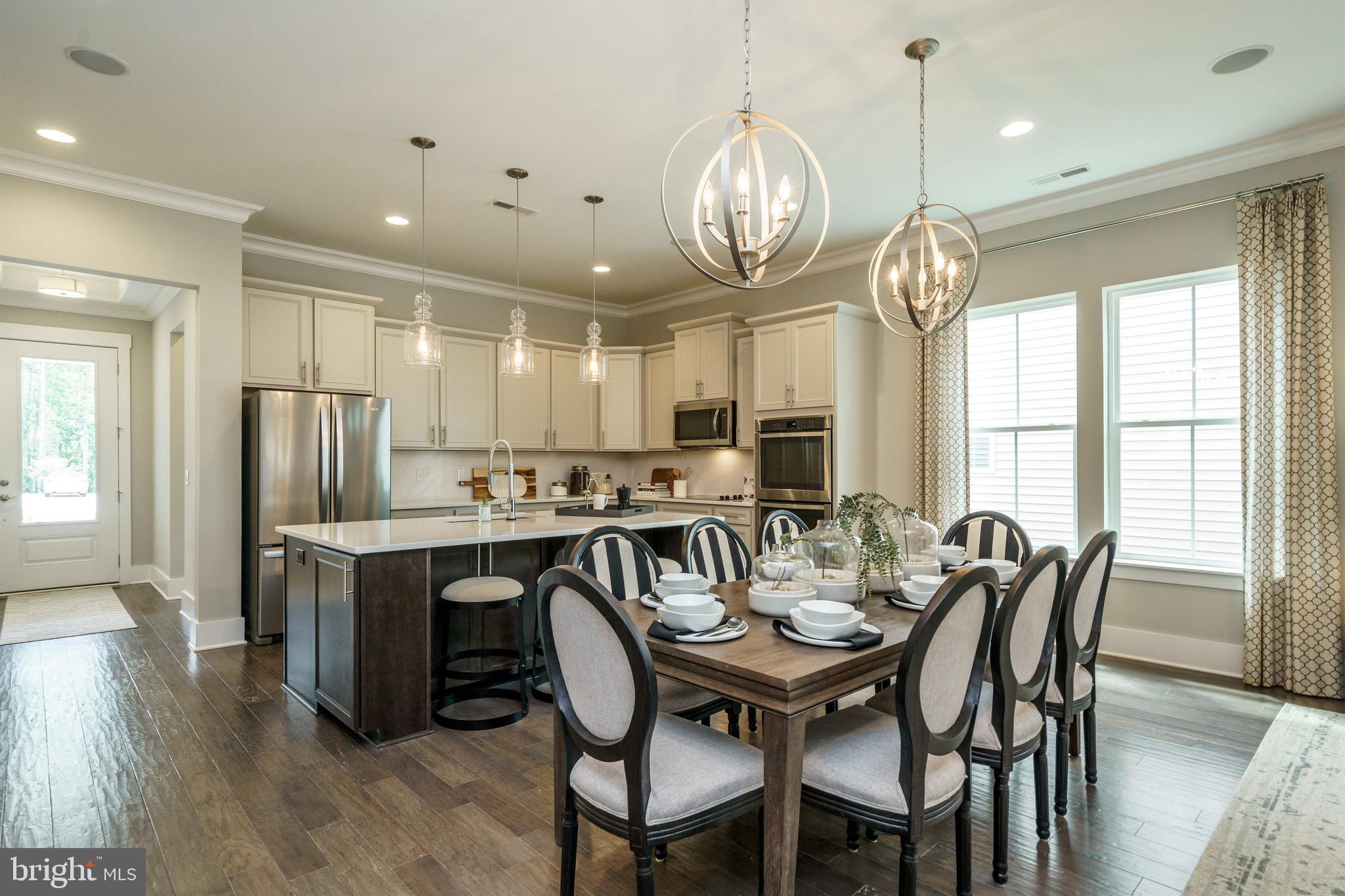 Tbb West Aster Way, Unit VIRTUOSO Gettysburg, PA 17325 - Photo 11 of 51 a view of a dining room with furniture window and wooden floor