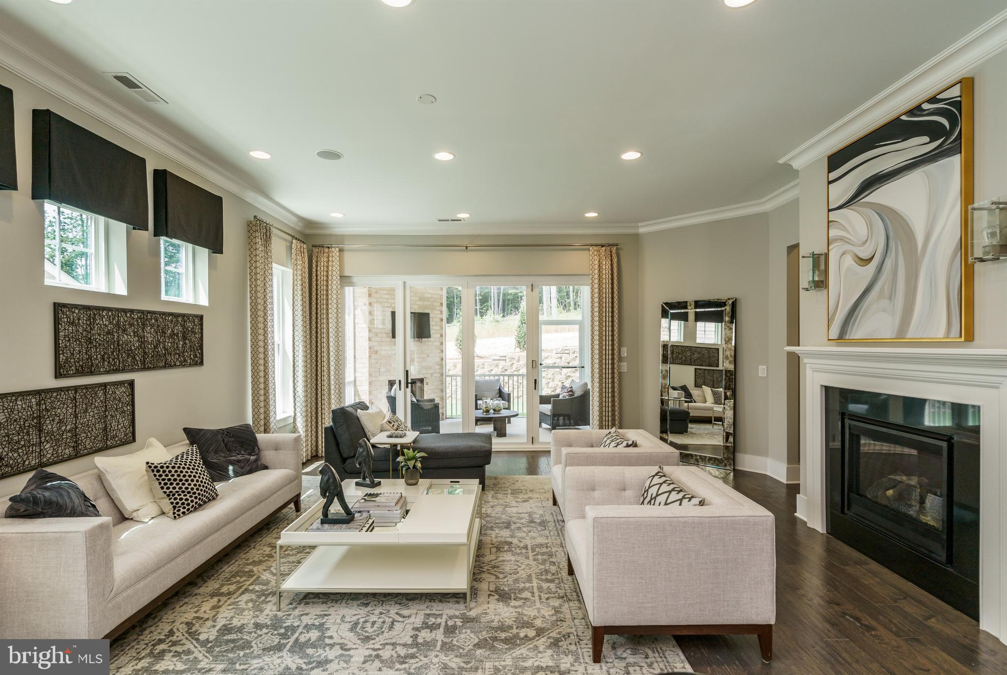 Tbb West Aster Way, Unit VIRTUOSO Gettysburg, PA 17325 - Photo 16 of 51 a living room with furniture a fireplace and a large window