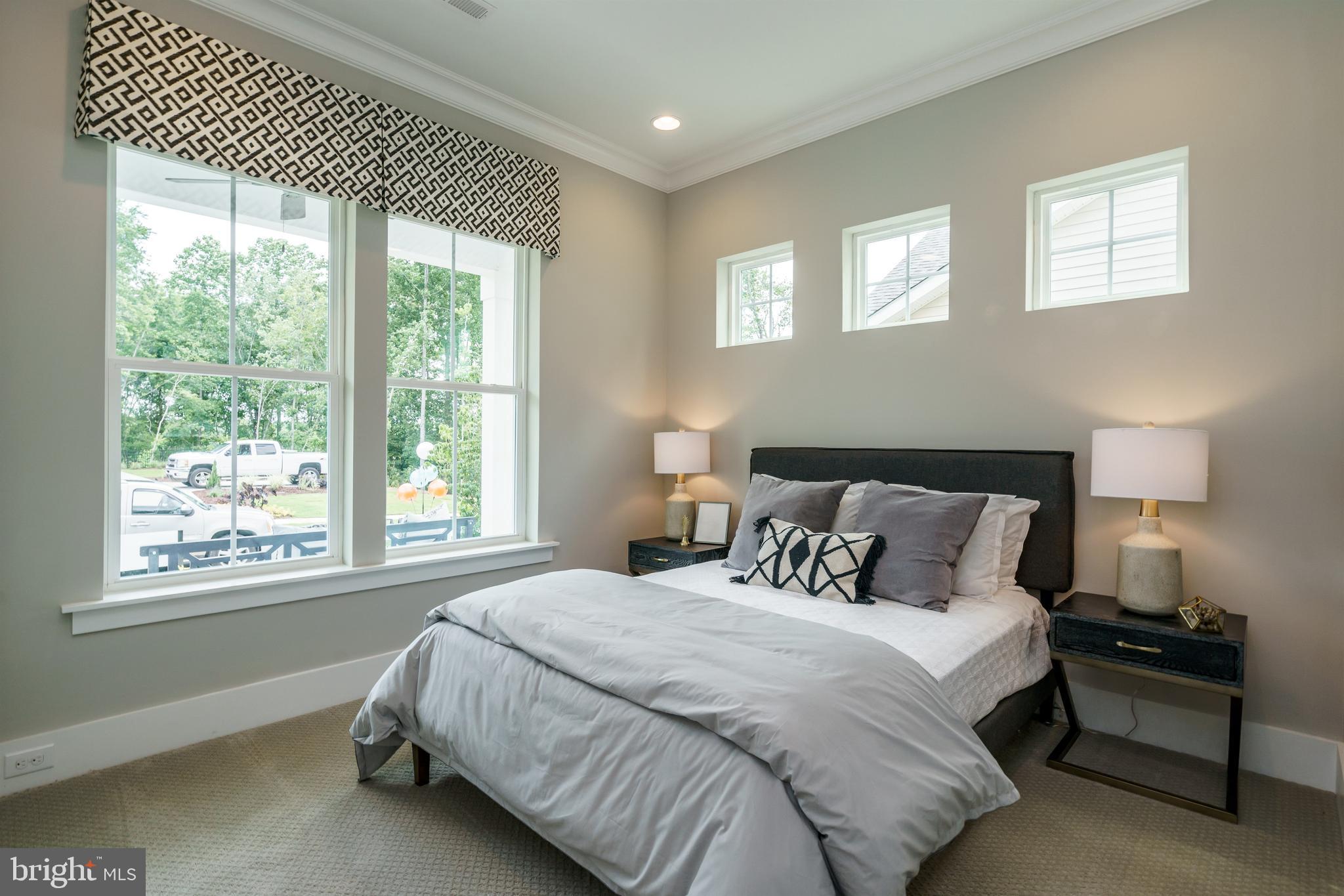 Tbb West Aster Way, Unit VIRTUOSO Gettysburg, PA 17325 - Photo 32 of 51 a bedroom with a bed and a night stand