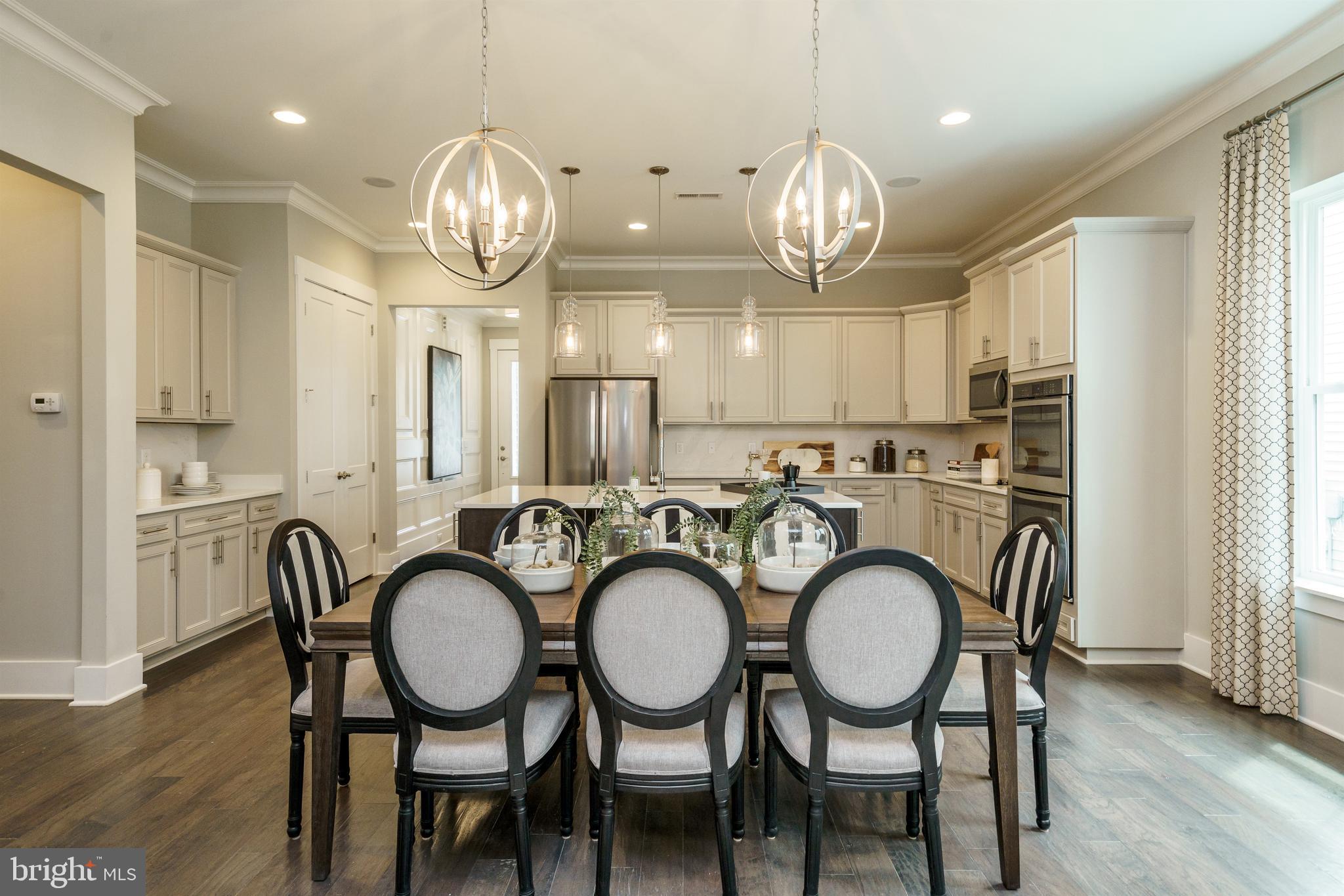 Tbb West Aster Way, Unit VIRTUOSO Gettysburg, PA 17325 - Photo 10 of 51 a view of a dining area with furniture window and wooden floor