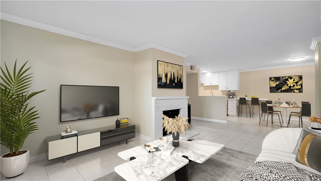 17522 Vandenberg Lane, Unit 3 Tustin, CA 92780 - Photo 1 of 27 a living room with furniture and a flat screen tv