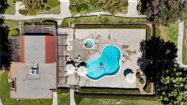 an aerial view of a fireplace with table and chairs