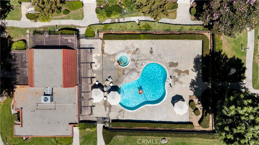 17522 Vandenberg Lane, Unit 3 Tustin, CA 92780 - Photo 11 of 27 an aerial view of a fireplace with table and chairs