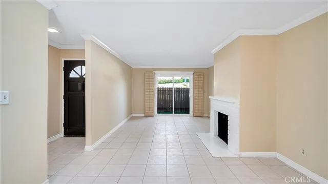 a view of empty room with a fireplace