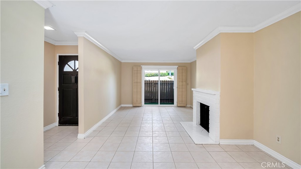 17522 Vandenberg Lane, Unit 3 Tustin, CA 92780 - Photo 14 of 27 a view of empty room with a fireplace